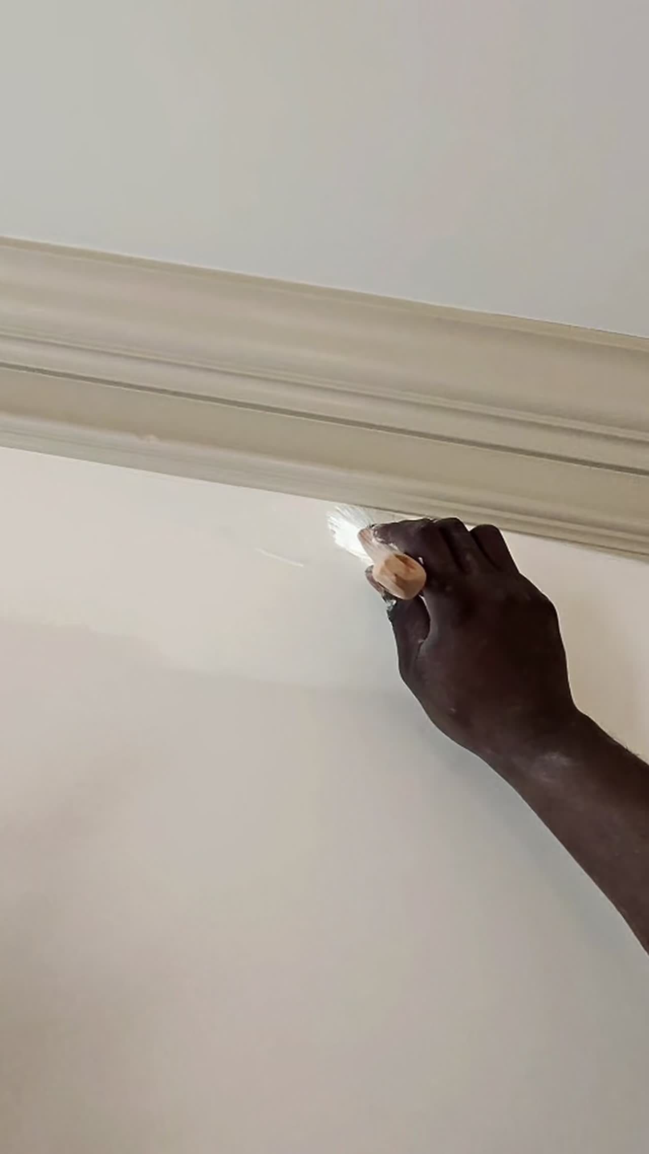 Royalty Home Improvement painter applying a careful finish